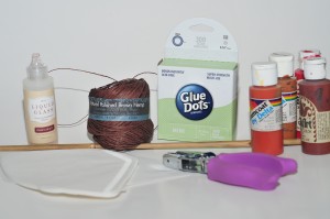 picture of coffee filters, Glue dots, hemp twine, acrylic paint and hole punch.